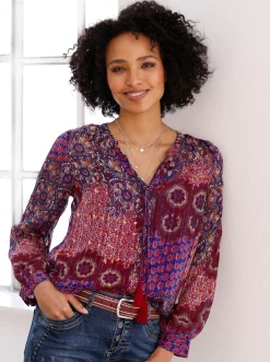 Druckbluse mit Quaste am Ausschnitt