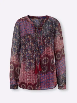 Druckbluse mit Quaste am Ausschnitt